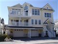 South End Estate. This amazing 5 BR home has awesome ocean views that can be seen from several of the 6 fiberglass decks. Also features: 4 full baths, 2 gas fireplaces, hardwood floors throughout the home. Amazing high-end kitchen, surround sound & more. Your family will enjoy the rear fenced in yard and extra large 2 car garage with ample storage. Call 1-888-602-3243 for an appointment